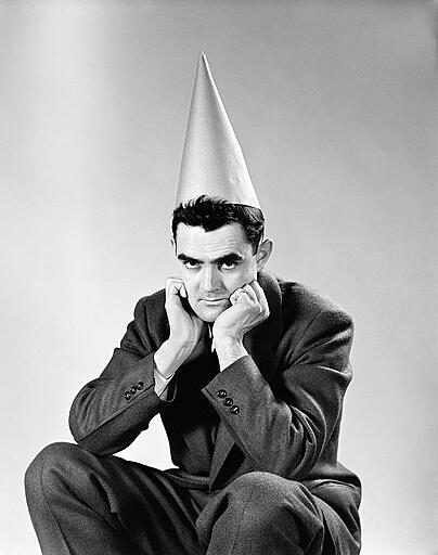 1950s-disguntled-man-wearing-dunce-cap-vintage-images.jpg